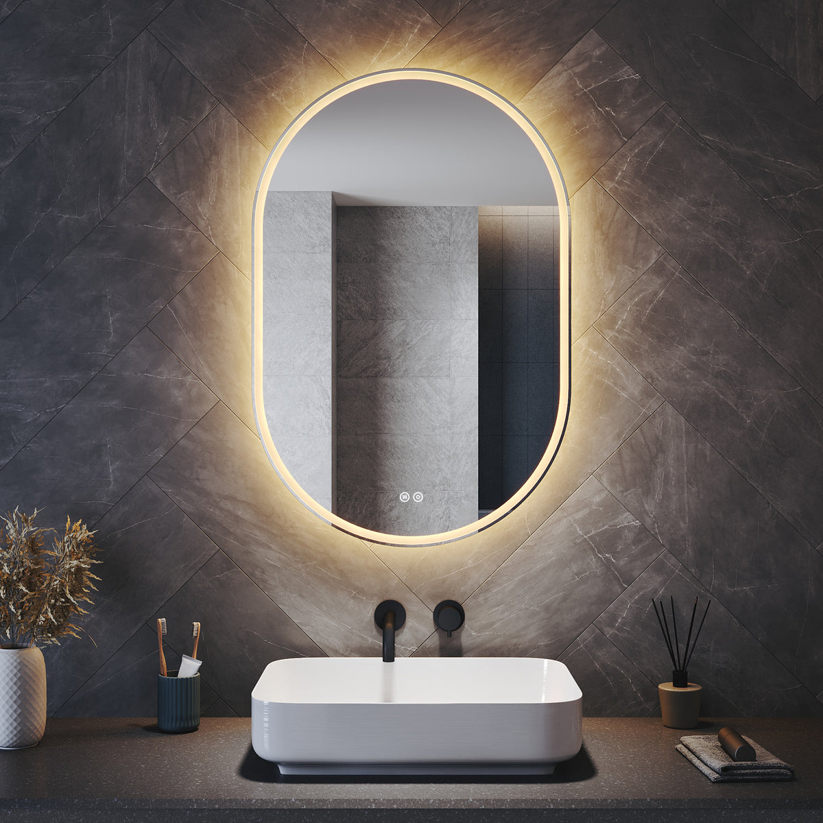 Oval LED bathroom mirror with anti-fog feature and shaver outlet, 800x500x35mm