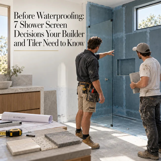 Builder and tiler discussing shower screen placement before waterproofing in an Australian bathroom renovation