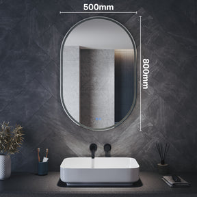 Oval LED bathroom mirror with anti-fog feature and shaver outlet, 800x500x35mm