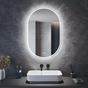 Oval LED bathroom mirror with anti-fog feature and shaver outlet, 800x500x35mm