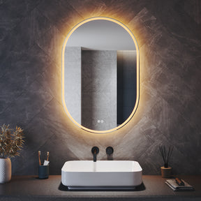 Oval LED bathroom mirror with anti-fog feature and shaver outlet, 800x500x35mm