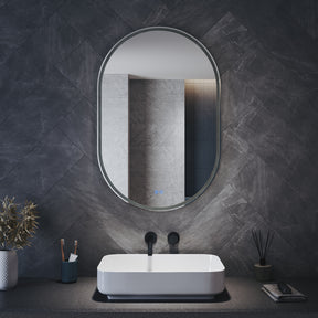 Oval LED bathroom mirror with anti-fog feature and shaver outlet, 800x500x35mm