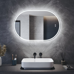 Oval LED bathroom mirror with anti-fog feature and shaver outlet, 800x500x35mm